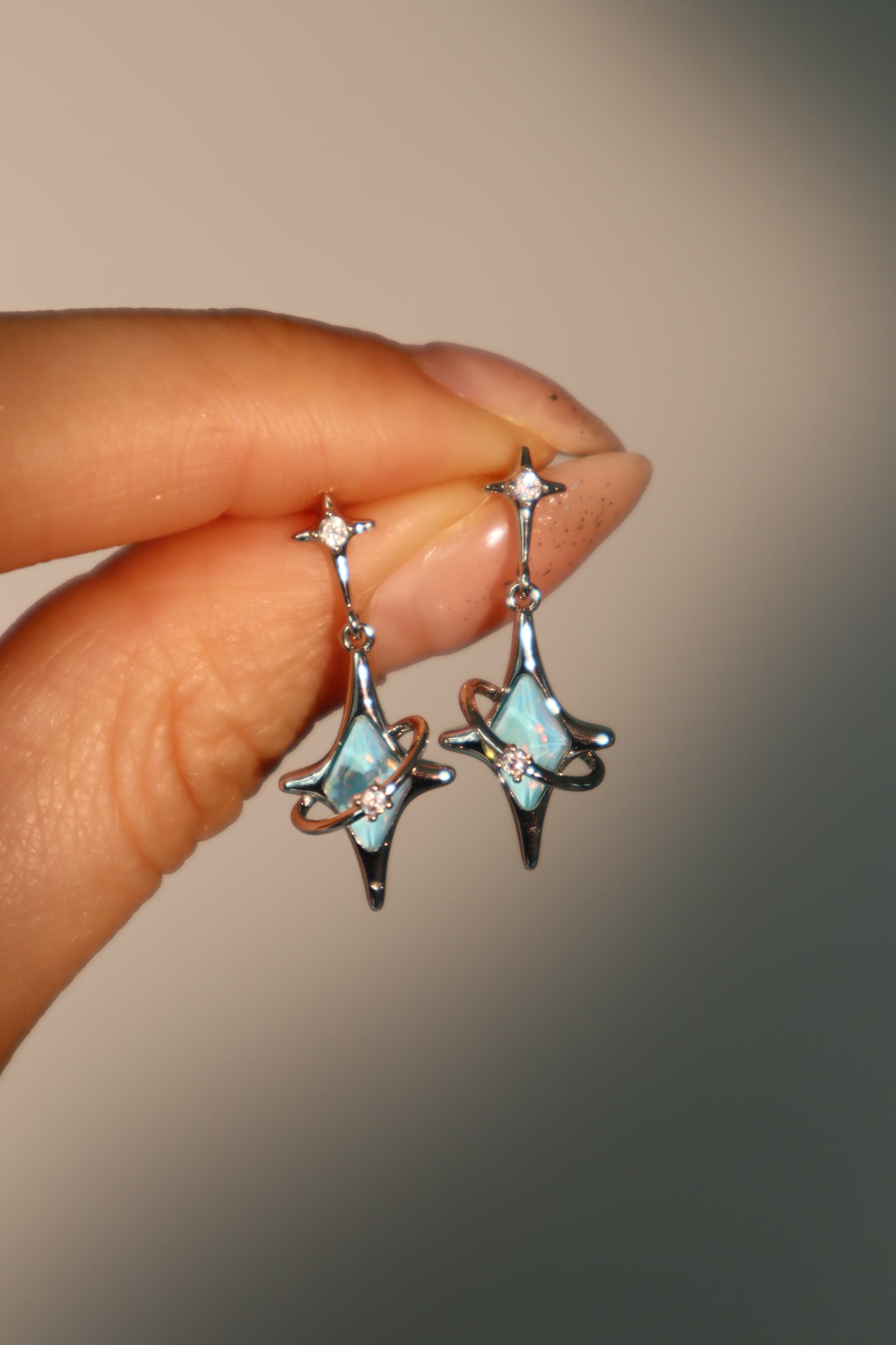Palladium White Gold Plated Blue Saturn Star Earrings