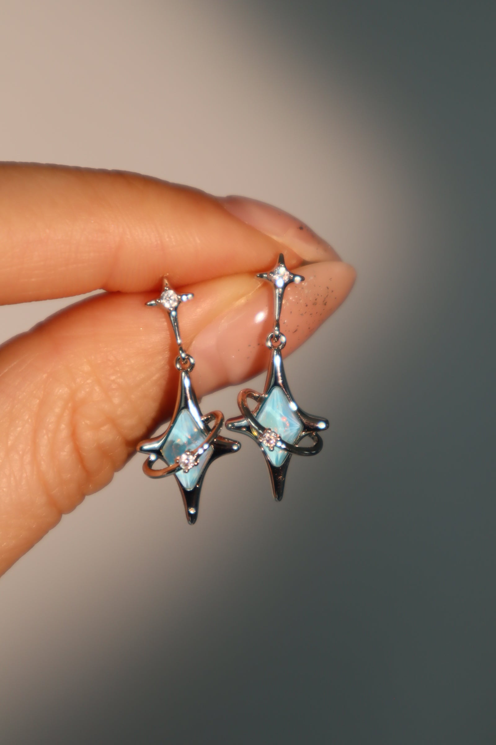 Palladium White Gold Plated Blue Saturn Star Earrings